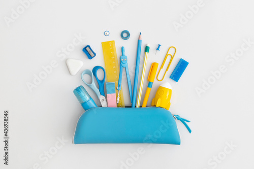 Tela Pencil case with school stationery on a grey background