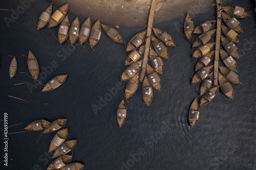 Aerial view of traditional fishing boats docked along Shitalakshya river in Bandar township, Dhaka state, Bangladesh. photo