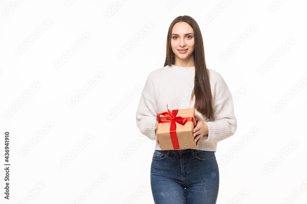 Happy smiling woman holding small red gift box isolated on white background Happy smiling woman holding small red gift box isolated on white background