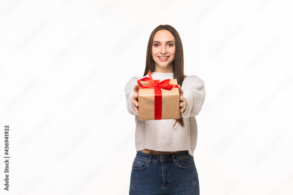 Happy smiling woman holding small red gift box isolated on white background Happy smiling woman holding small red gift box isolated on white background