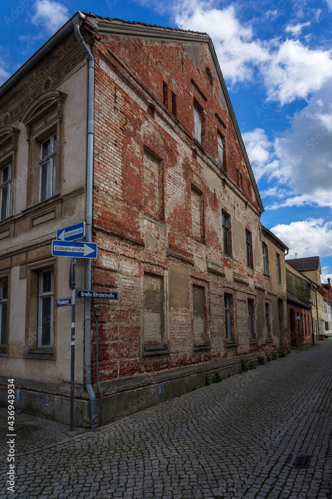 Streets and facade with street names and one-way traffic signs in old town. Juterbog is a historic town in north-eastern Germany, in the district of Brandenburg.
