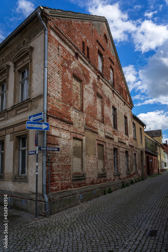Streets and facade with street names and one-way traffic signs in old town. Juterbog is a historic town in north-eastern Germany, in the district of Brandenburg.