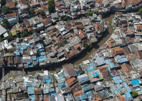 Aerial view of densely populated residential area in Bandung City, capital of West Java Province, Indonesia. Crowding of residential constructions in Asia.