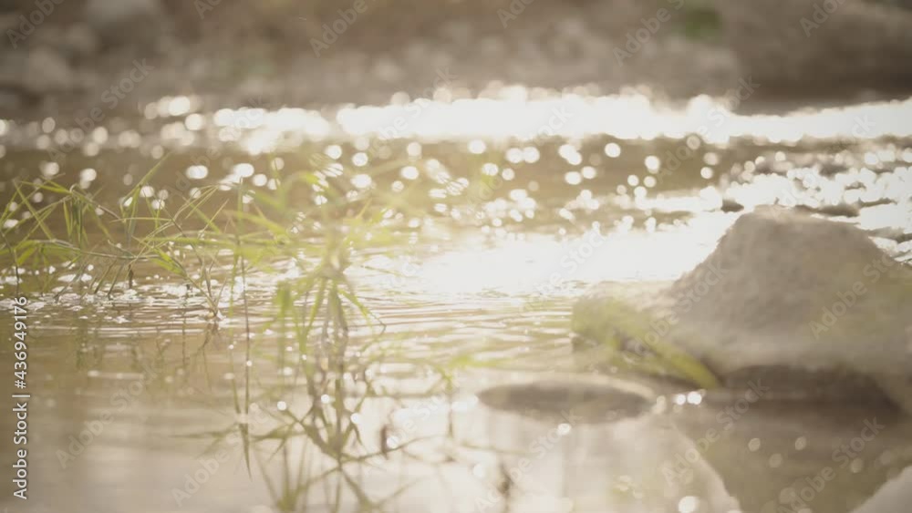 Feel the passing of time as you look at the flow of the ripple illuminated at dusk Feel the passing of time as you look at the flow of the ripple illuminated at dusk