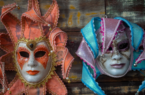 Venetian carnival masks set in wood. Luxury, mystery and glamor in typical Venetian festivity.