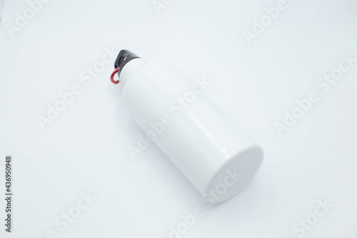 White disposable glossy cup with lid and straw.