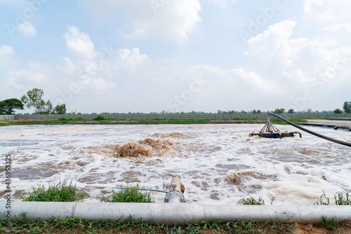 Blower air increase the oxygen in wastewater treatment pond. photo