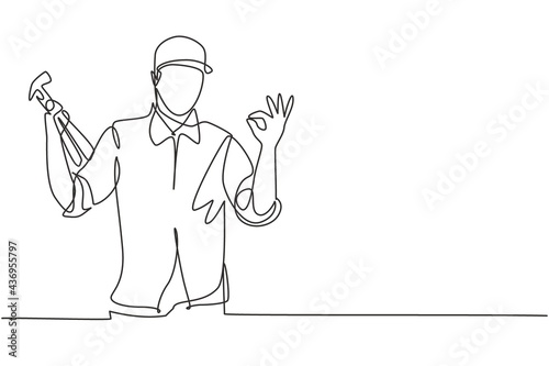 Single one line drawing of carpenter with gesture okay works in his workshop making wooden products. Skills in using carpentry tools. Modern continuous line draw design graphic vector illustration