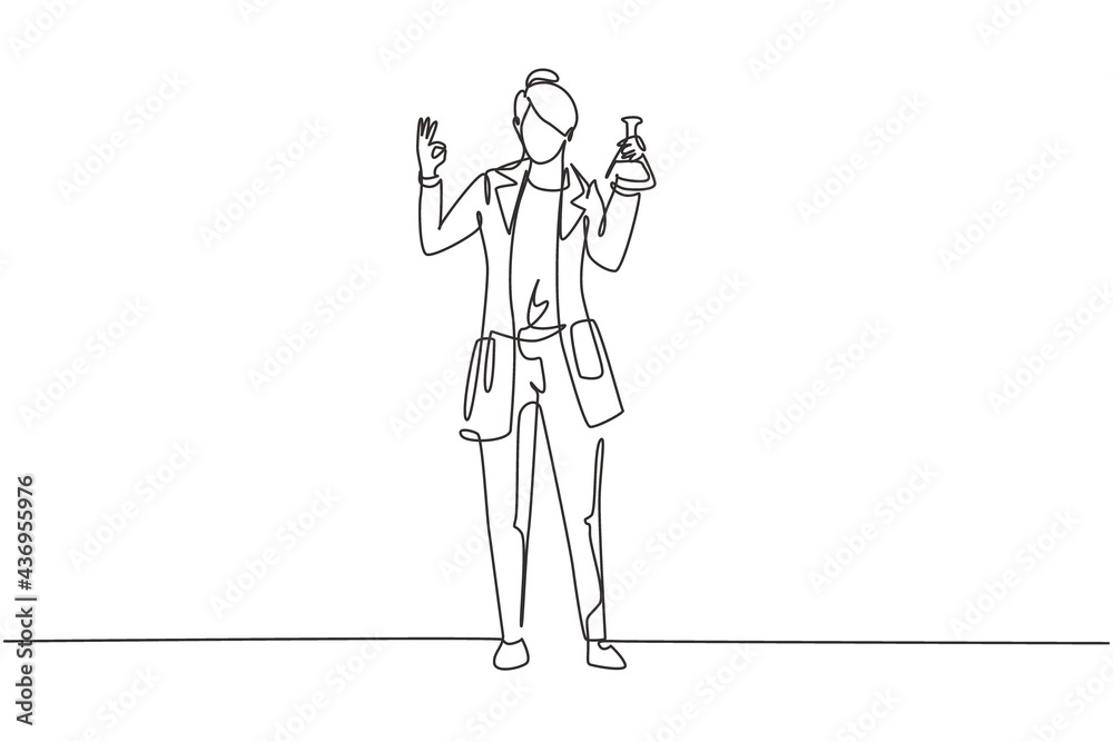 Single one line drawing female scientist stands with gesture okay and holding measuring tube filled with chemical liquid. Success work. Modern continuous line draw design graphic vector illustration