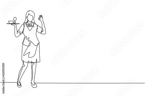 Continuous one line drawing waitress stood up with gesture okay and brought tray of drinking glasses to offer restaurant guests. Professional job. Single line draw design vector graphic illustration