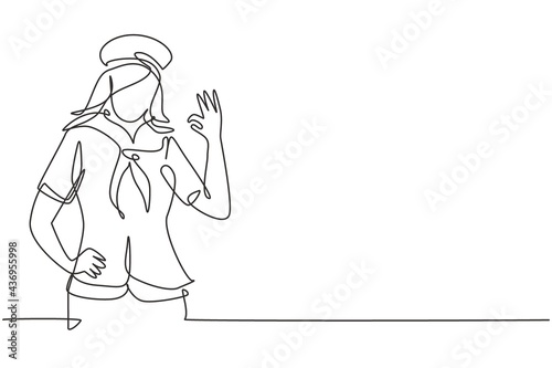 Slika na platnu Single one line drawing sailor woman with gesture okay and scarf around his neck ready sail across seas in a ship headed by captain