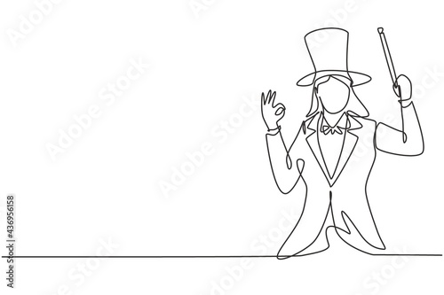 Single continuous line drawing female magician with gesture okay wearing hat and holding magic stick ready to entertain audience at television show. One line draw graphic design vector illustration