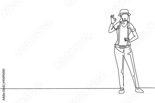 Continuous one line drawing female mime artist stands with gesture okay and white face make-up makes audience laugh with silent comedy. Great show. Single line draw design vector graphic illustration