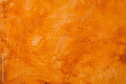 Textured wall brushed painted Background, Abstract Orange Oil Color.