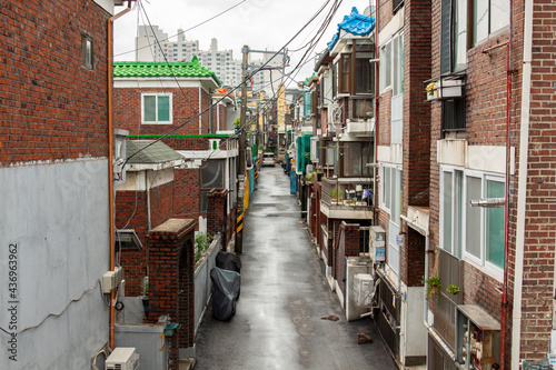 An old residential alleyway in Korea, a residential area built of red bricks.