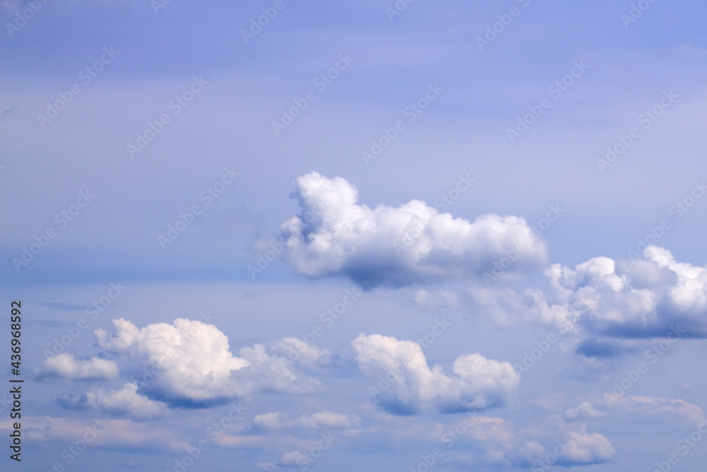 White fluffy clouds on blue sky on a sunny day White fluffy clouds on blue sky on a sunny day