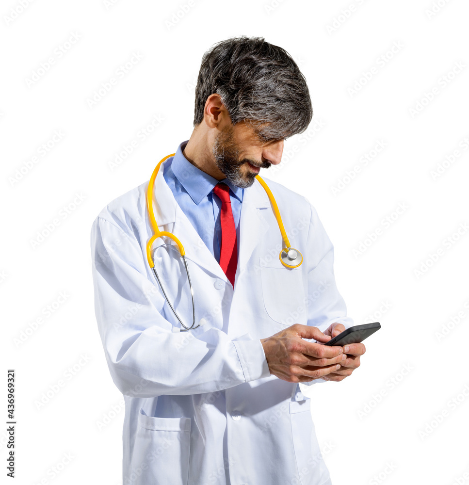 Male doctor standing watching media on his smartphone Male doctor standing watching media on his smartphone