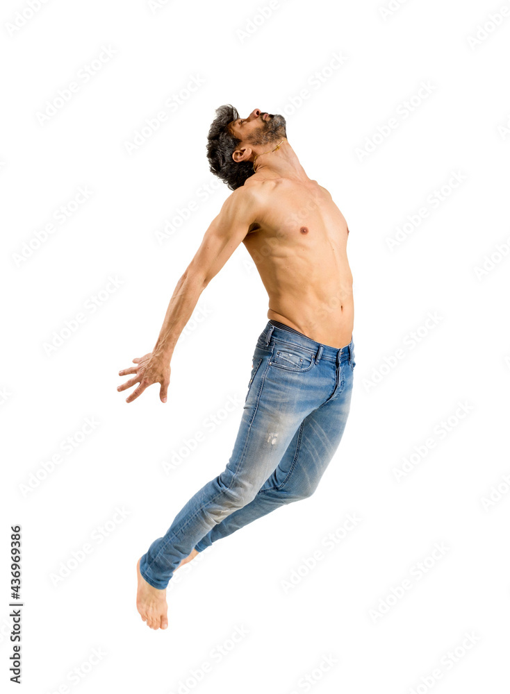 Fit shirtless barefoot man leaping in the air Fit shirtless barefoot man leaping in the air