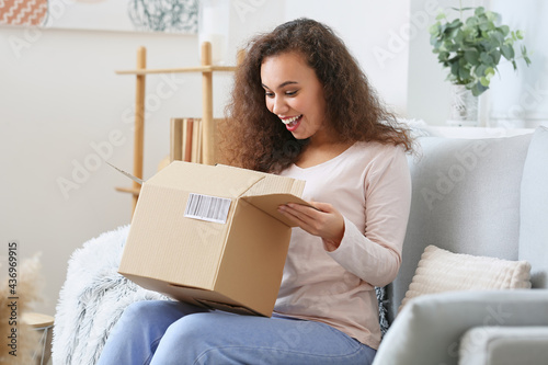 Young woman with parcel at ...