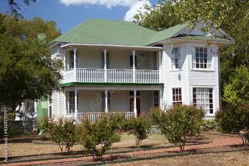 Large Historic Mansion With Green Lawn and Trees