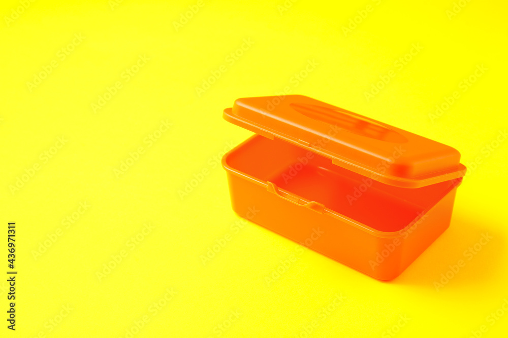 Plastic lunch box on color background