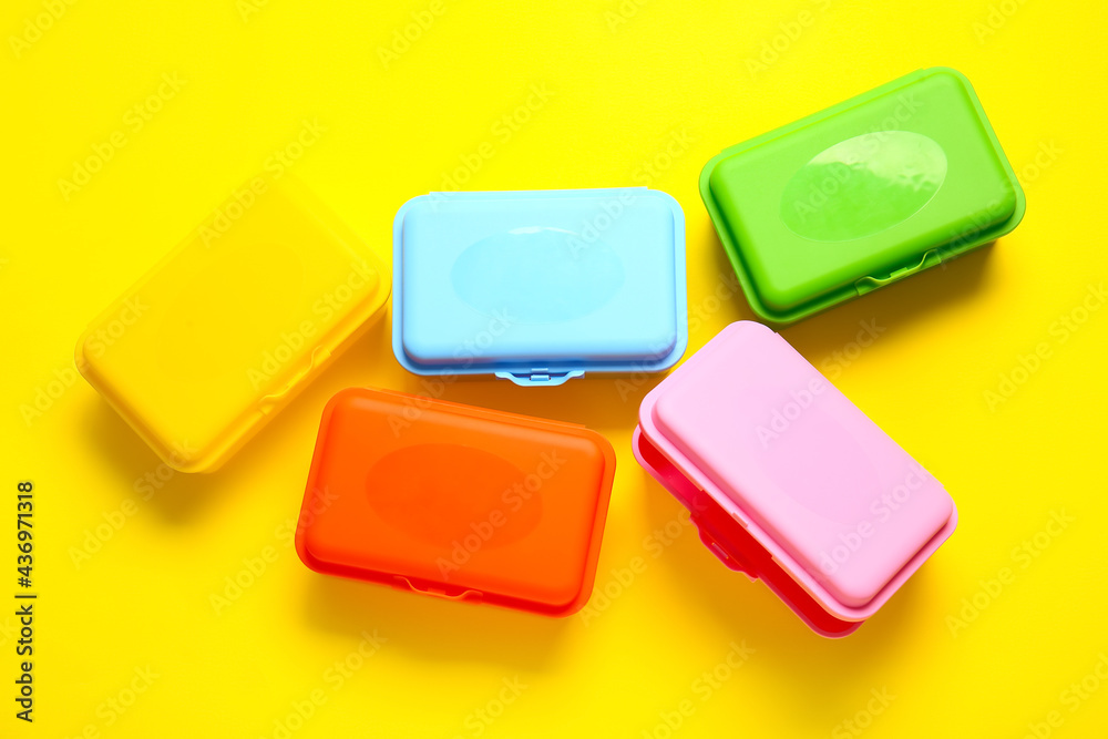 Plastic lunch boxes on color background