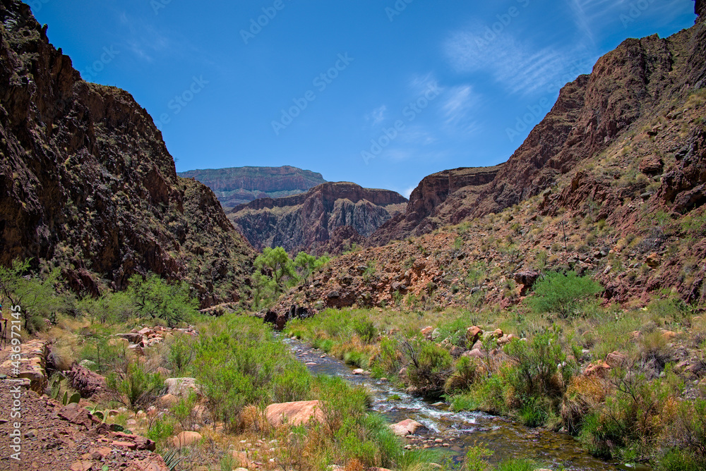 View of Grand Canyon valley floor from North Kaibab bright angel trail along bright angel creek flowing with spring snow melt into colorado river. View of Grand Canyon valley floor from North Kaibab bright angel trail along bright angel creek flowing with spring snow melt into colorado river.