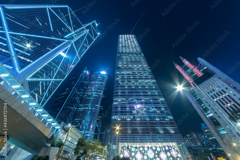 Skyscraper in downtown district of Hong Kong city at night Skyscraper in downtown district of Hong Kong city at night