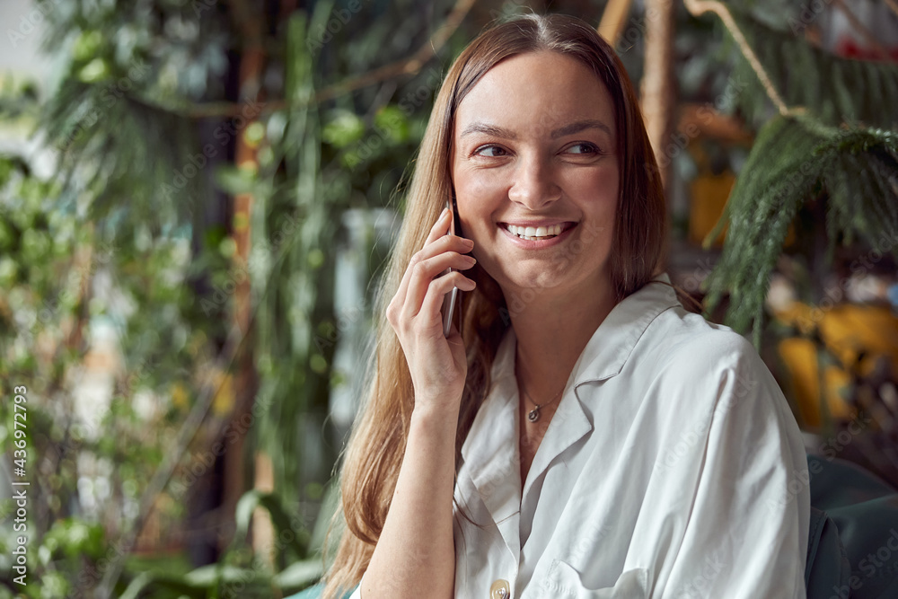 Young caucasian happy seller woman at botanic shop Young caucasian happy seller woman at botanic shop