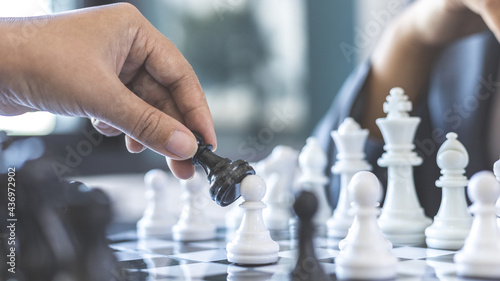 Business woman playing chess, Proactive business planning and marketing strategy just like playing chess, Business competition and success or leadership, Planning and strategies for victory concept.