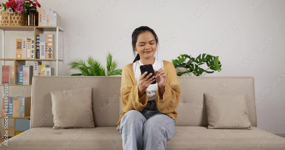 Girl playing game on smartphone Girl playing game on smartphone