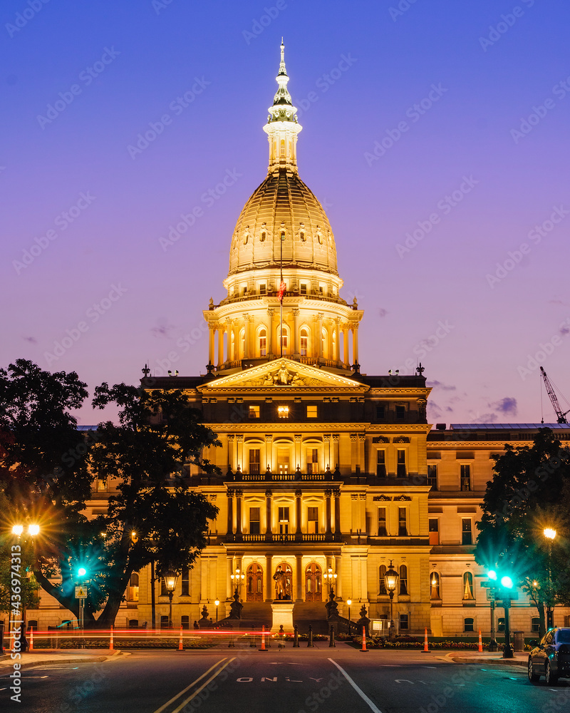 Michigan State Capitol with lights on after sunset