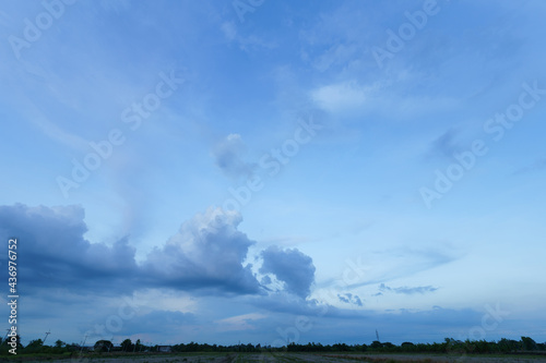 Twilight blue bright dramatic sunset sky in countryside or beach colorful cloudscape texture with white clouds air background.