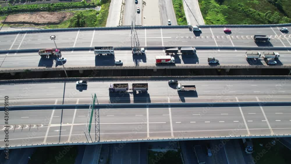Aerial overlooking the hiway with cars, trucks and other transport. Shoot from drone. 4K video Aerial overlooking the hiway with cars, trucks and other transport. Shoot from drone. 4K video