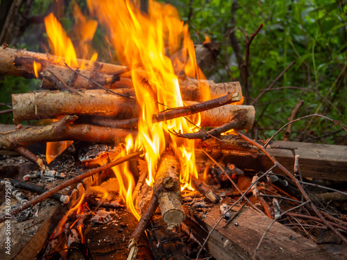 Image of flames, burning dry twigs. The concept of danger, respect for nature. Fires in the forest.