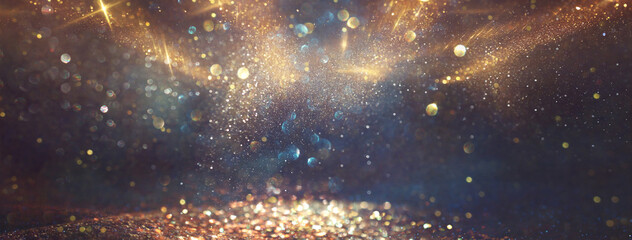 background of abstract glitter lights. gold, blue and black. de focused