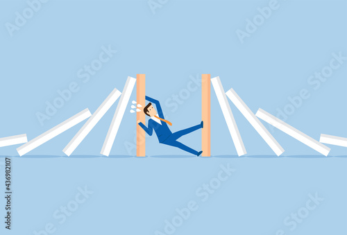 Businessman stop two ways domino effect