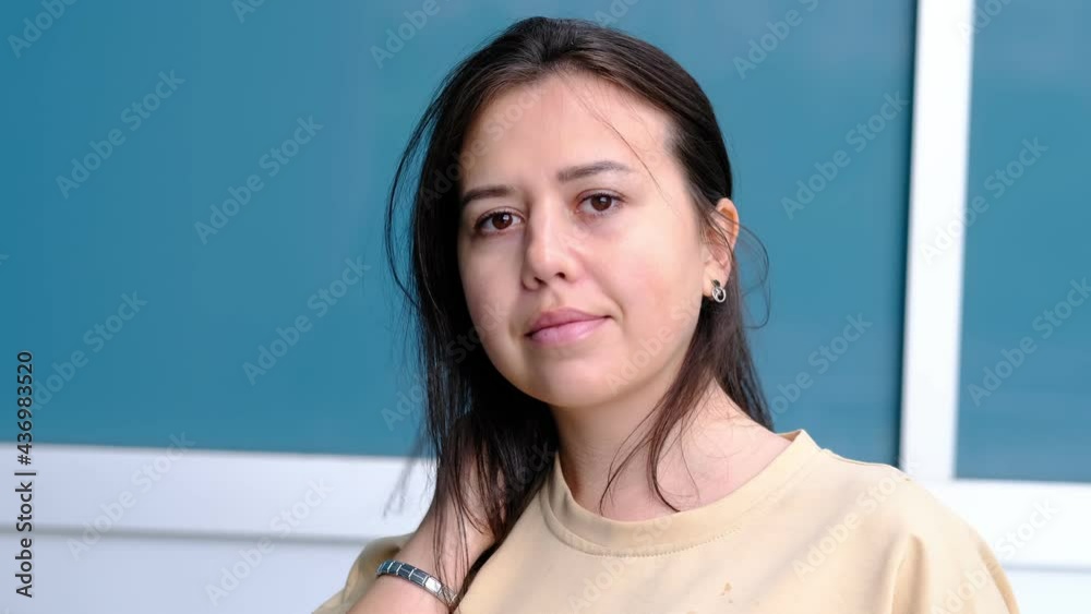 Portrait of young adult Hispanic woman looking into camera. Portrait of young adult Hispanic woman looking into camera.