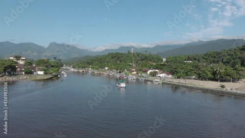 Tour boat on Rio Pereque in picturesque colonial town Paraty, Brazil photo