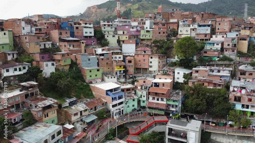 Rising aerial of steep hillside favela community in mountainous city Rising aerial of steep hillside favela community in mountainous city