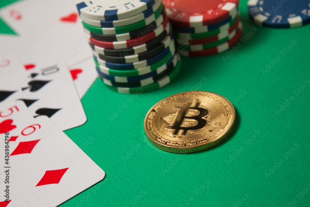 Classic playing cards, chips, bitcoin and dollars on green background. Gambling and casino concept.