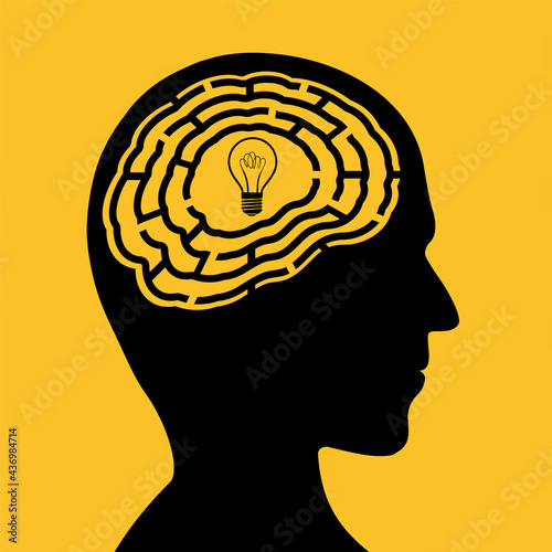 Human head with a maze and light bulb