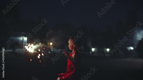 4th of July Background of Little Girl Playing with Sparkler