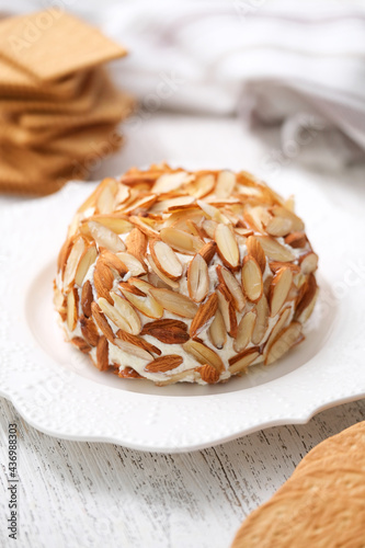 Homemade classic cheese ball with crackers. photo