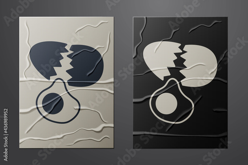 White Broken egg icon isolated on crumpled paper background. Happy Easter. Paper art style. Vector
