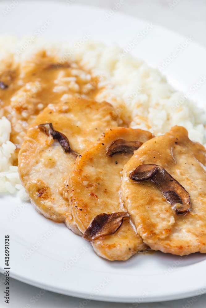 poultry meat with mushroom sauce and rice
