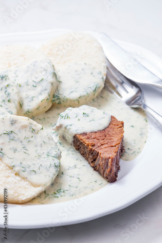 beef meat with dill sauce and dumplings