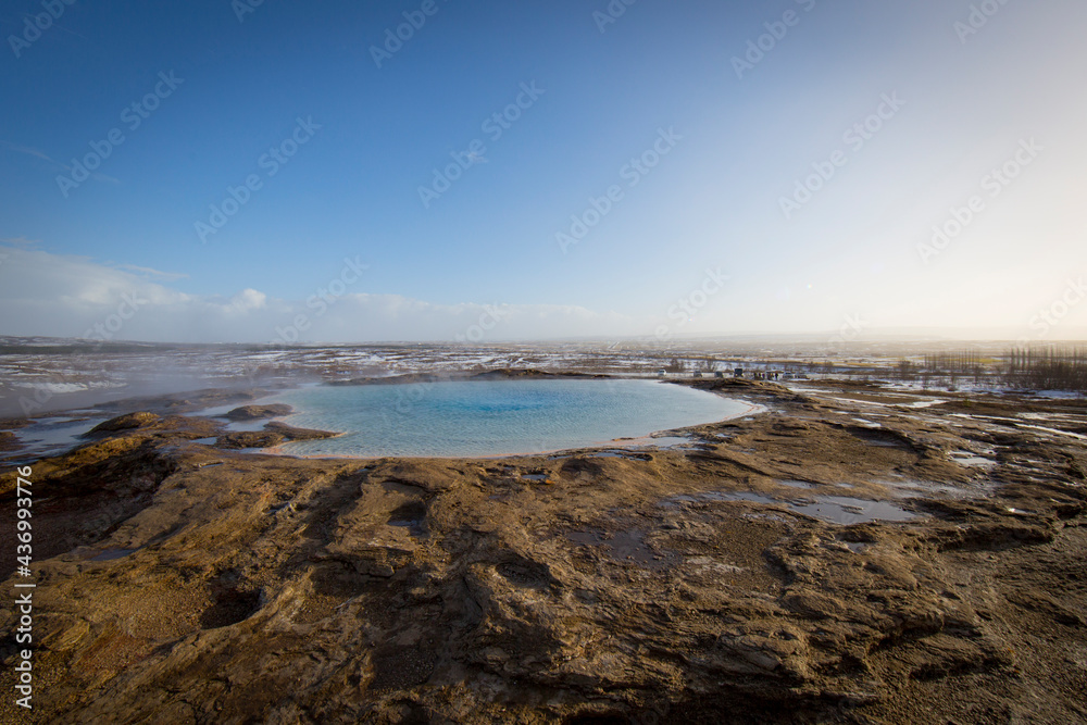 geyser in iceland, the water is colored by algae
