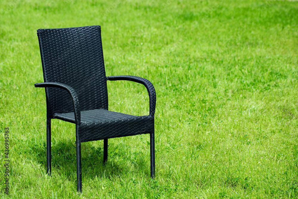garden furniture, rattan chair on a green lawn . garden furniture   