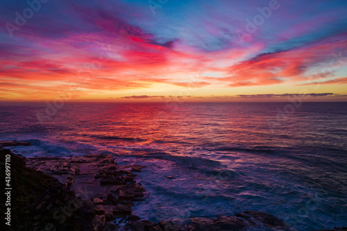 Aerial Sunrise Seascape at Rocky Inlet with colourful high cloud